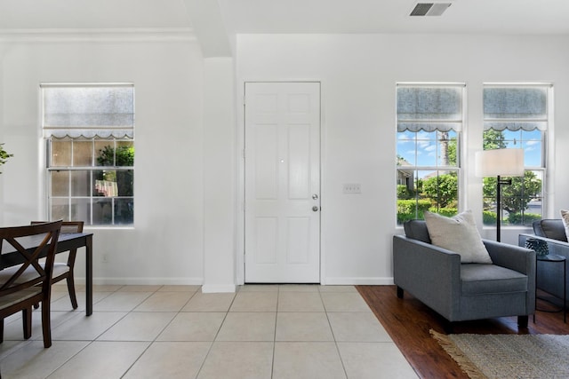 2721 Stuart Ave, Clovis, CA 93611 - foyer entrance with light tile patterned flooring, baseboards, and crown molding
