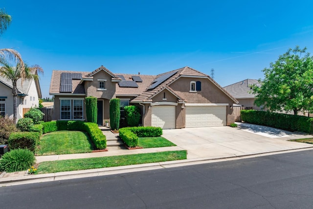 2721 Stuart Ave, Clovis, CA 93611 - traditional-style home featuring stucco siding, driveway, roof mounted solar panels, a garage, and a tiled roof