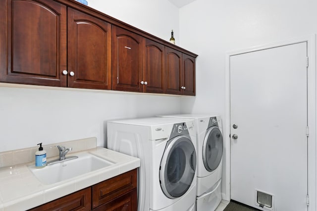 2721 Stuart Ave, Clovis, CA 93611 - washroom featuring cabinet space and independent washer and dryer