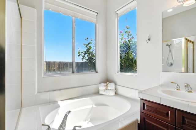2721 Stuart Ave, Clovis, CA 93611 - full bathroom featuring vanity, a bath, and a shower stall