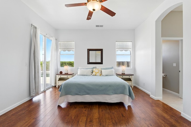 2721 Stuart Ave, Clovis, CA 93611 - bedroom with access to exterior, wood-type flooring, arched walkways, and baseboards