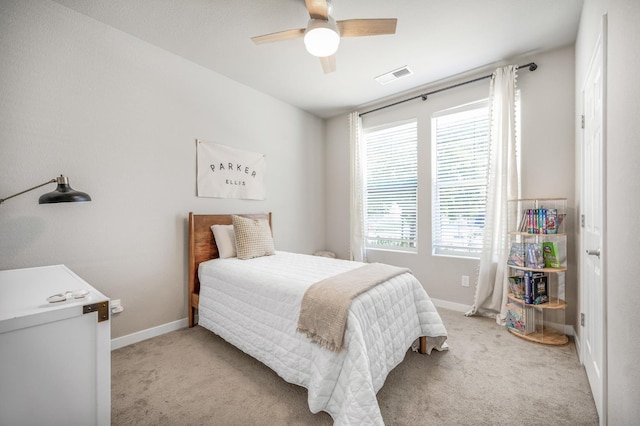 6085 E Homan Ave, Fresno, CA 93727 - bedroom with light carpet, baseboards, and ceiling fan
