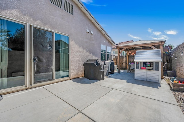 6085 E Homan Ave, Fresno, CA 93727 - fenced backyard featuring a patio area and a gazebo