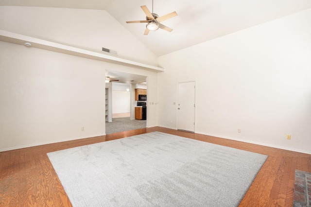 392 W Magill Ave, Clovis, CA 93612 - spare room with ceiling fan, high vaulted ceiling, wood finished floors, and baseboards