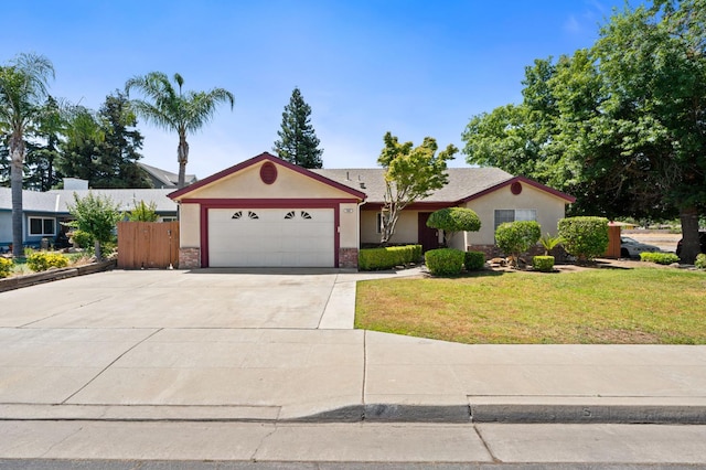 392 W Magill Ave, Clovis, CA 93612 - single story home with an attached garage, stucco siding, a front yard, driveway, and brick siding