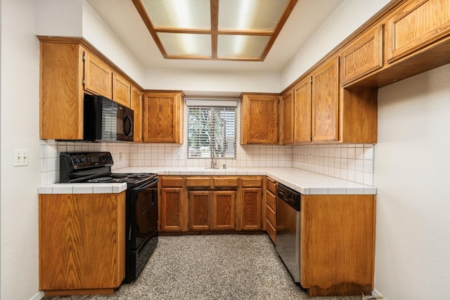 392 W Magill Ave, Clovis, CA 93612 - kitchen with black appliances, brown cabinets, decorative backsplash, and tile countertops