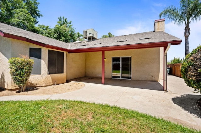 392 W Magill Ave, Clovis, CA 93612 - back of property featuring stucco siding, a patio, a chimney, and roof with shingles