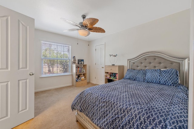 8519 E Olive Ave, Fresno, CA 93737 - bedroom featuring light carpet, baseboards, and a ceiling fan