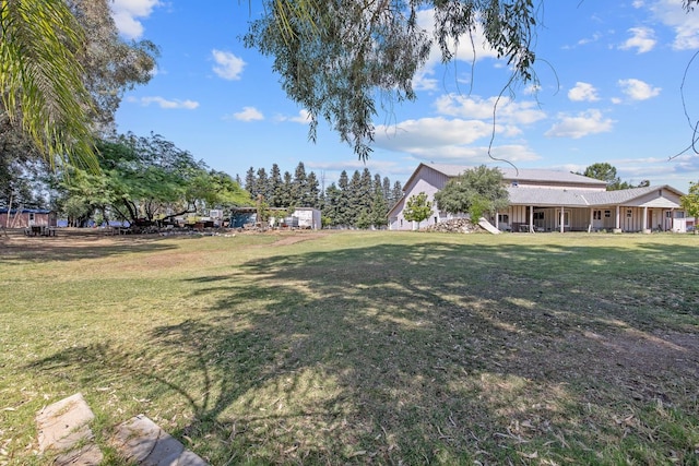 8519 E Olive Ave, Fresno, CA 93737 - view of grassy yard featuring covered porch