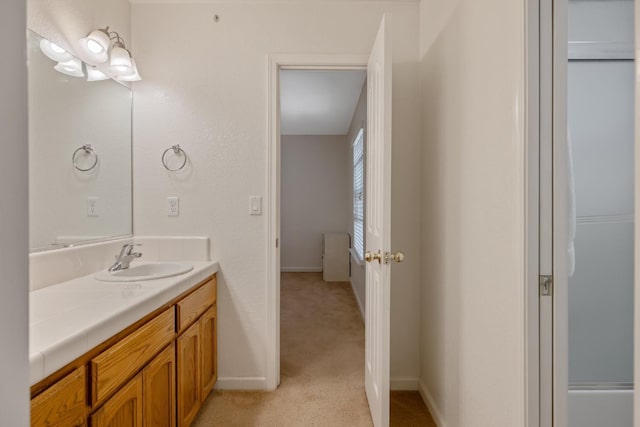 8519 E Olive Ave, Fresno, CA 93737 - bathroom with vanity and baseboards