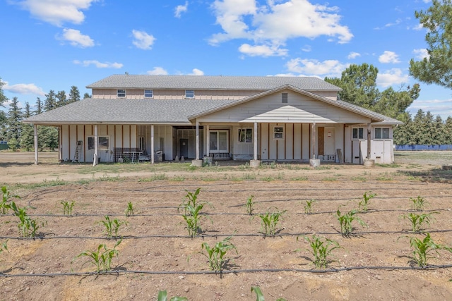 8519 E Olive Ave, Fresno, CA 93737 - view of front of house featuring board and batten siding, a porch, and roof with shingles