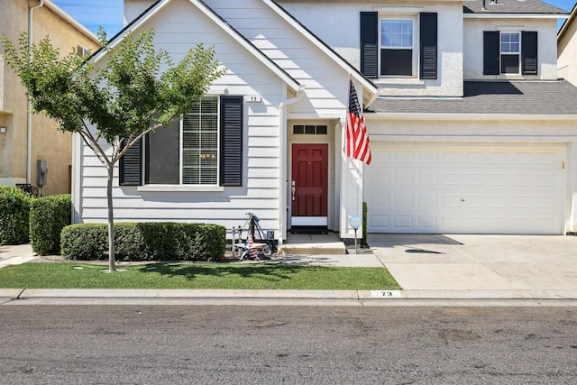 73 W Bordeaux Ln, Clovis, CA 93619 - view of front of home featuring driveway, a garage, and a shingled roof