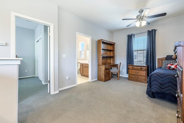 73 W Bordeaux Ln, Clovis, CA 93619 - bedroom featuring light carpet, connected bathroom, baseboards, and a ceiling fan