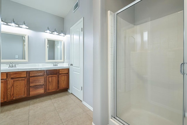 73 W Bordeaux Ln, Clovis, CA 93619 - full bath featuring a stall shower, tile patterned flooring, double vanity, and baseboards