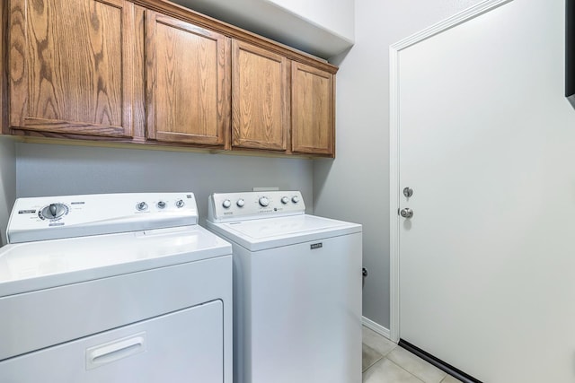 73 W Bordeaux Ln, Clovis, CA 93619 - laundry room featuring separate washer and dryer, cabinet space, light tile patterned floors, and baseboards