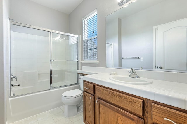73 W Bordeaux Ln, Clovis, CA 93619 - full bath with vanity, tile patterned floors, toilet, and enclosed tub / shower combo
