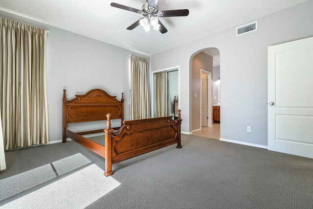 73 W Bordeaux Ln, Clovis, CA 93619 - carpeted bedroom with arched walkways, baseboards, and ceiling fan