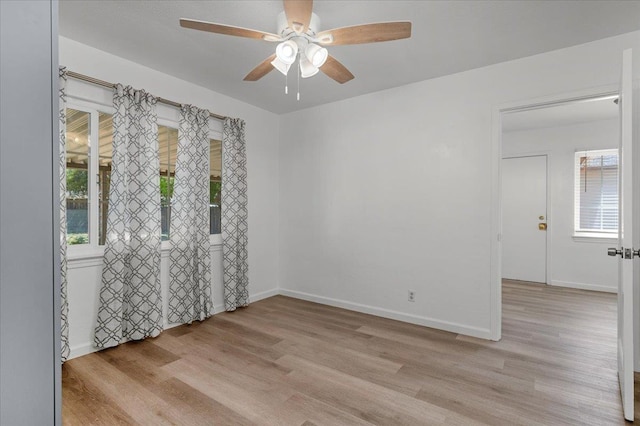 826 W Fedora Ave, Fresno, CA 93705 - unfurnished room with light wood-style flooring, ceiling fan, and baseboards