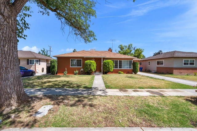 826 W Fedora Ave, Fresno, CA 93705 - view of front of property with a front yard and a chimney