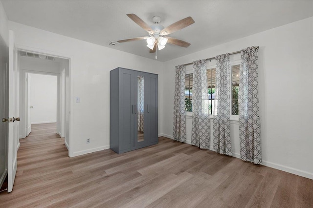 826 W Fedora Ave, Fresno, CA 93705 - unfurnished bedroom with baseboards, light wood-style floors, and ceiling fan