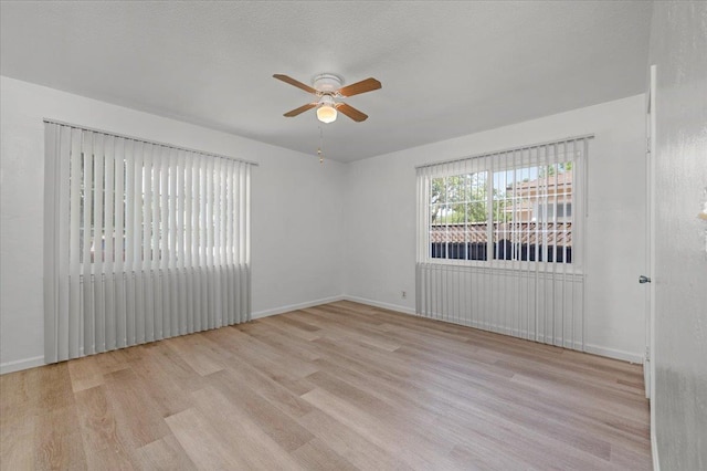 826 W Fedora Ave, Fresno, CA 93705 - spare room with a ceiling fan, wood finished floors, and baseboards