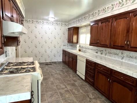 1320 Maple, Selma, CA 93662 - kitchen featuring white appliances, ventilation hood, and wallpapered walls