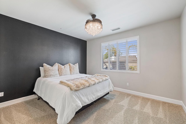 7374 E Flint Way, Fresno, CA 93737 - carpeted bedroom with a chandelier and baseboards