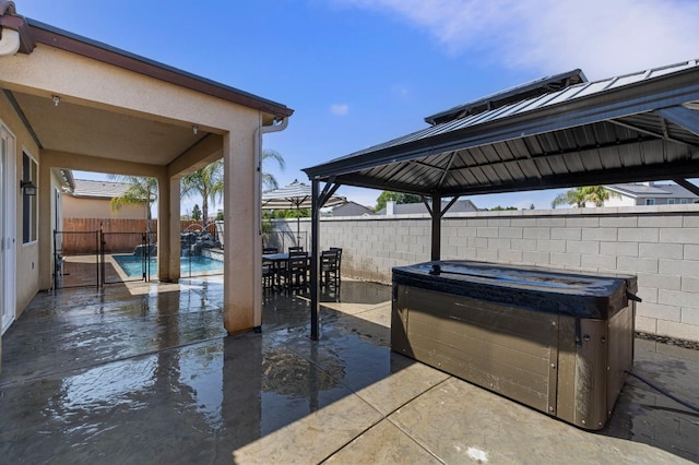 7374 E Flint Way, Fresno, CA 93737 - fenced backyard with a patio, a gazebo, and a hot tub