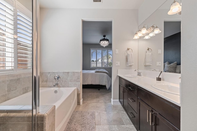 7374 E Flint Way, Fresno, CA 93737 - full bath with connected bathroom, double vanity, a bath, and stone finish flooring