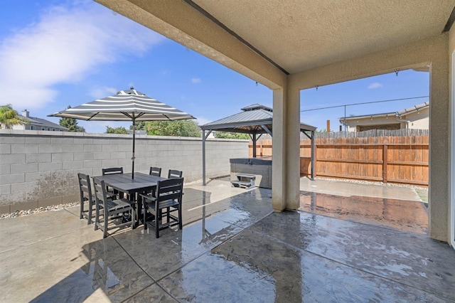 7374 E Flint Way, Fresno, CA 93737 - fenced backyard with a hot tub, a patio, a gazebo, and outdoor dining area