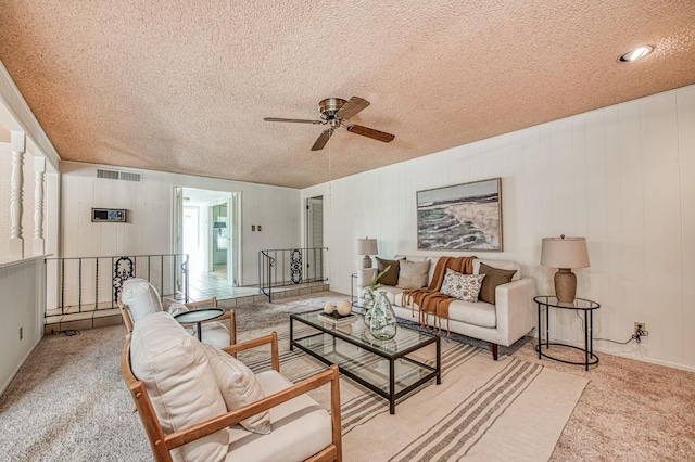 4588 E Pico Ave, Fresno, CA 93726 - carpeted living room featuring ceiling fan and a textured ceiling