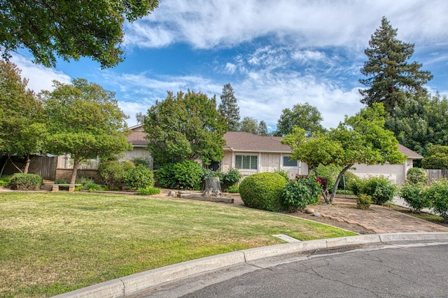 4588 E Pico Ave, Fresno, CA 93726 - obstructed view of property featuring an attached garage