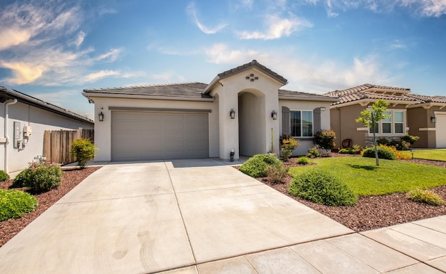 511 Timberline Way S, Madera, CA 93636 - mediterranean / spanish home featuring stucco siding, a garage, driveway, and a tile roof