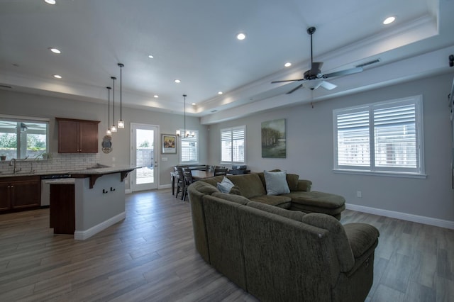 511 Timberline Way S, Madera, CA 93636 - living room featuring a tray ceiling, healthy amount of natural light, wood finished floors, and recessed lighting