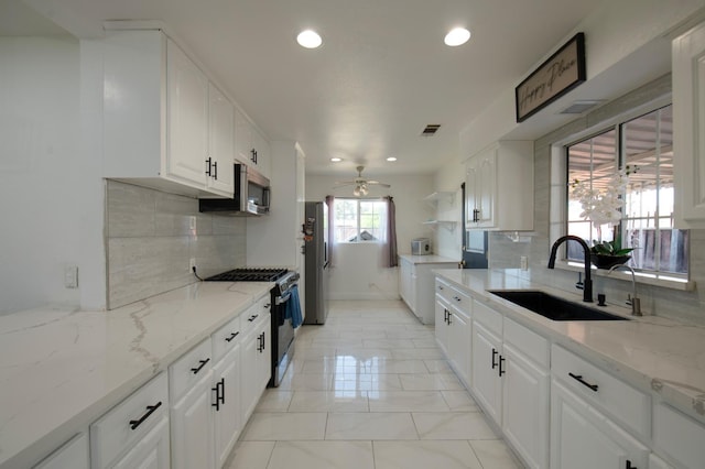 168 E Stuart Ave, Fresno, CA 93710 - kitchen with a sink, appliances with stainless steel finishes, ceiling fan, recessed lighting, and tasteful backsplash