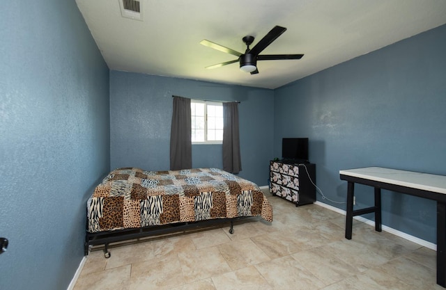 168 E Stuart Ave, Fresno, CA 93710 - bedroom featuring baseboards, ceiling fan, and a textured wall