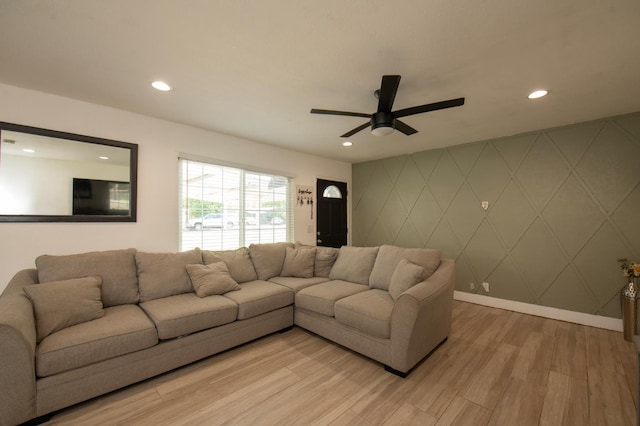 168 E Stuart Ave, Fresno, CA 93710 - living area featuring light wood finished floors, recessed lighting, a ceiling fan, an accent wall, and baseboards