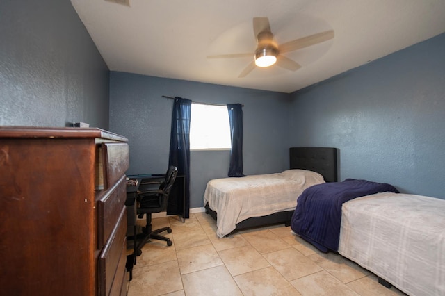 168 E Stuart Ave, Fresno, CA 93710 - bedroom featuring a textured wall, light tile patterned floors, and ceiling fan