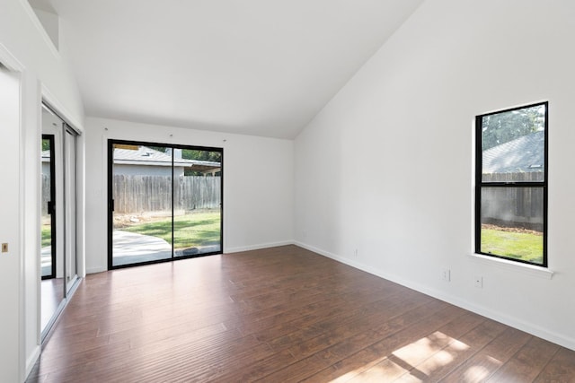 6546 N Bendel Ave, Fresno, CA 93722 - spare room featuring hardwood / wood-style flooring, vaulted ceiling, and baseboards
