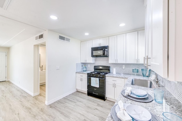 4005 E Turner Ave, Fresno, CA 93702 - kitchen featuring black appliances, a sink, tasteful backsplash, light wood-style floors, and light stone countertops