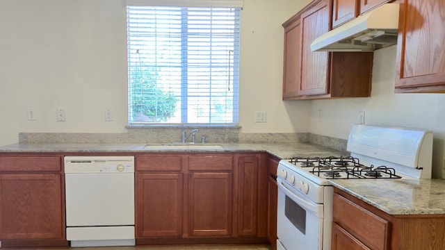 758 Persimmon, Madera, CA 93638 - kitchen with white appliances, under cabinet range hood, a sink, and brown cabinetry