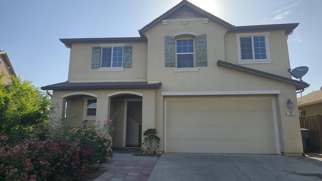 758 Persimmon, Madera, CA 93638 - traditional-style home featuring stucco siding, an attached garage, and driveway