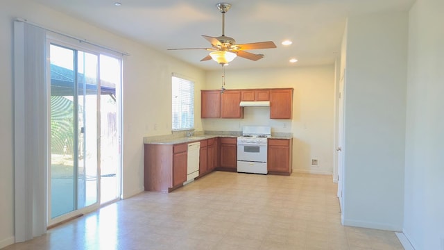 758 Persimmon, Madera, CA 93638 - kitchen with white appliances, a sink, under cabinet range hood, light countertops, and a ceiling fan