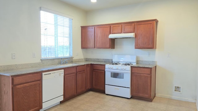 758 Persimmon, Madera, CA 93638 - kitchen featuring white appliances, under cabinet range hood, a sink, and plenty of natural light