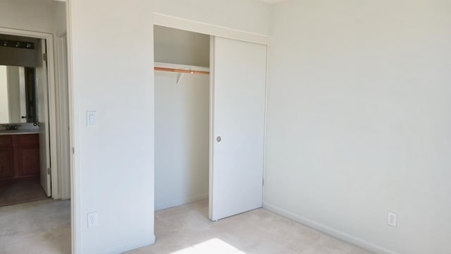 758 Persimmon, Madera, CA 93638 - unfurnished bedroom with a closet, light carpet, and baseboards