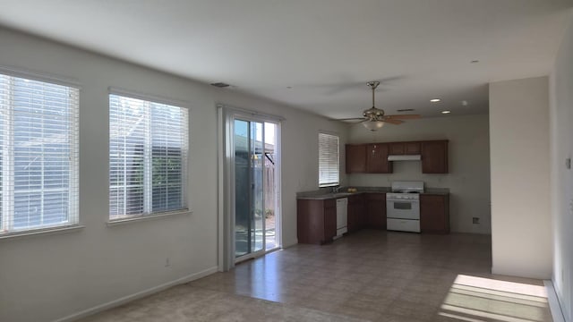 758 Persimmon, Madera, CA 93638 - kitchen featuring white appliances, under cabinet range hood, ceiling fan, a sink, and baseboards