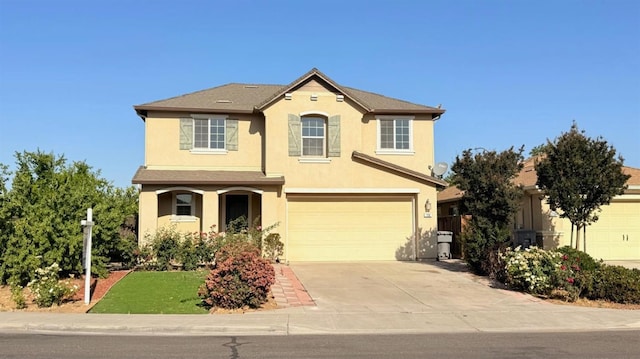 758 Persimmon, Madera, CA 93638 - traditional-style home featuring driveway, stucco siding, and a garage