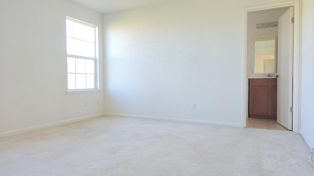 758 Persimmon, Madera, CA 93638 - empty room with light carpet, baseboards, and a sink