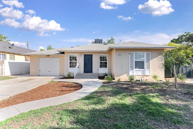 3446 E Lamona Ave, Fresno, CA 93703 - single story home with stucco siding, driveway, and a garage