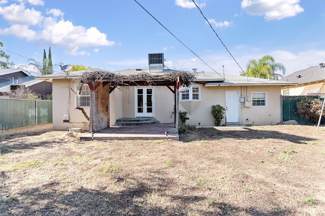3446 E Lamona Ave, Fresno, CA 93703 - back of house featuring french doors and stucco siding